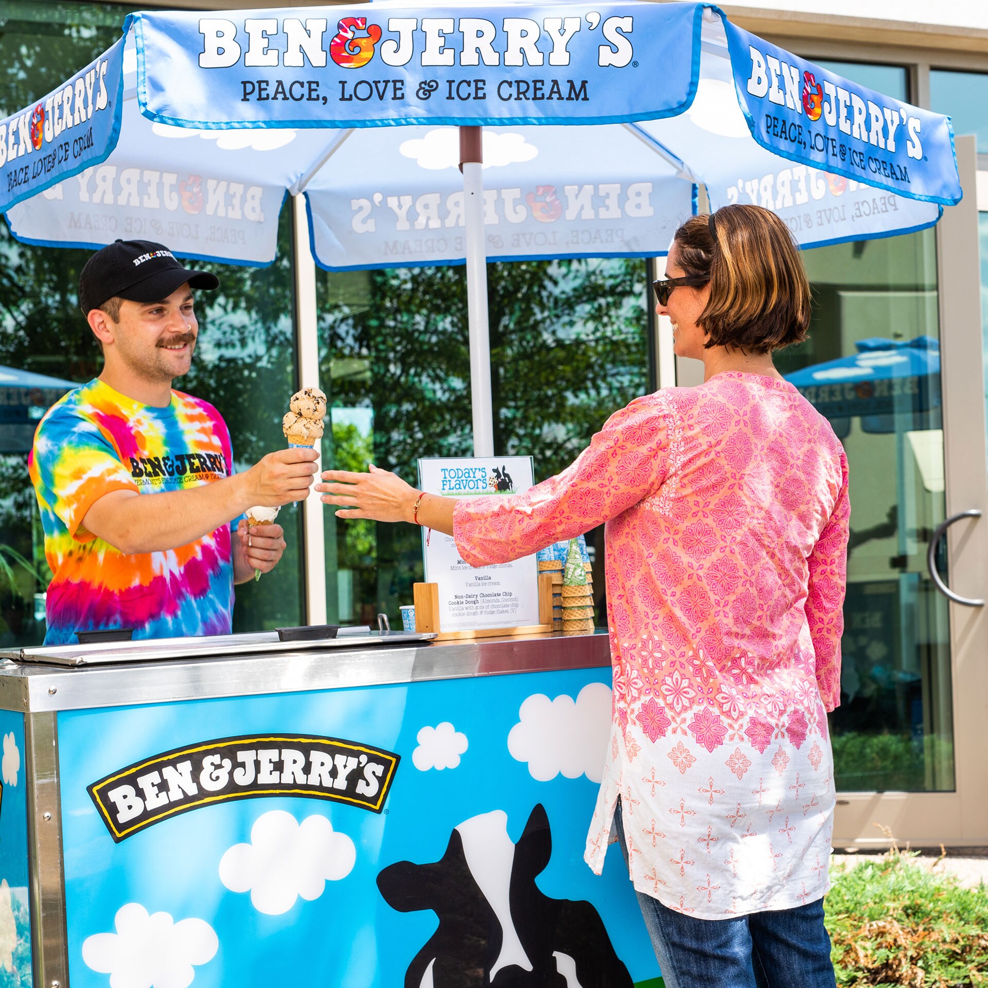 Ben & Jerry's scooper handing someone an ice cream cone