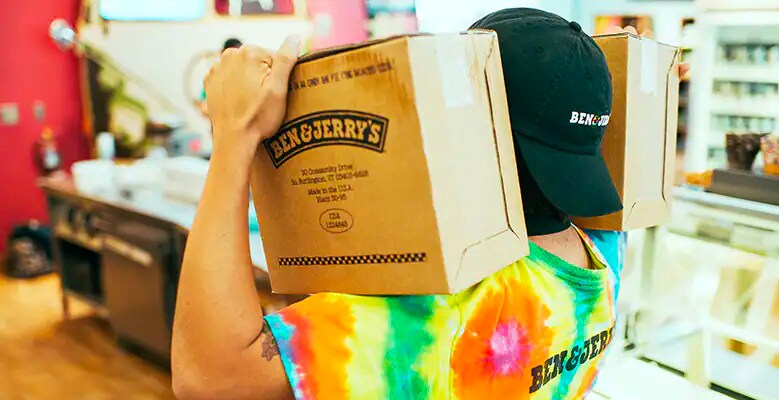 scooper carrying a ub of ice cream